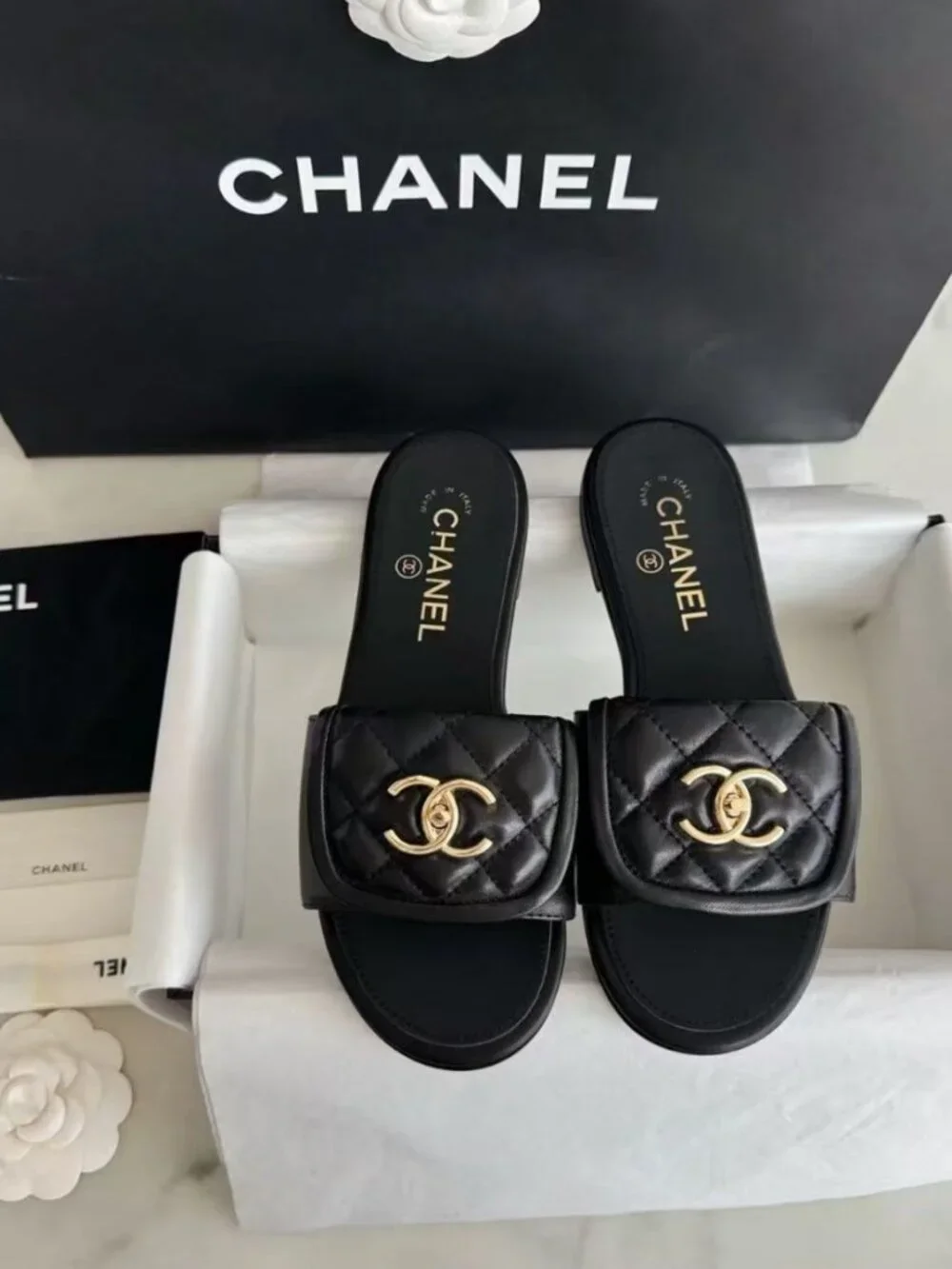 CHANEL Black Quilted Leather CC Turn‑Lock Flat Slide Sandals